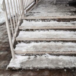 Ice forms on front porch and stairs | Next Level Outdoor Services