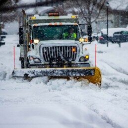 A Snowplow Clears a Long Driveway | Next Level Outdoor Services